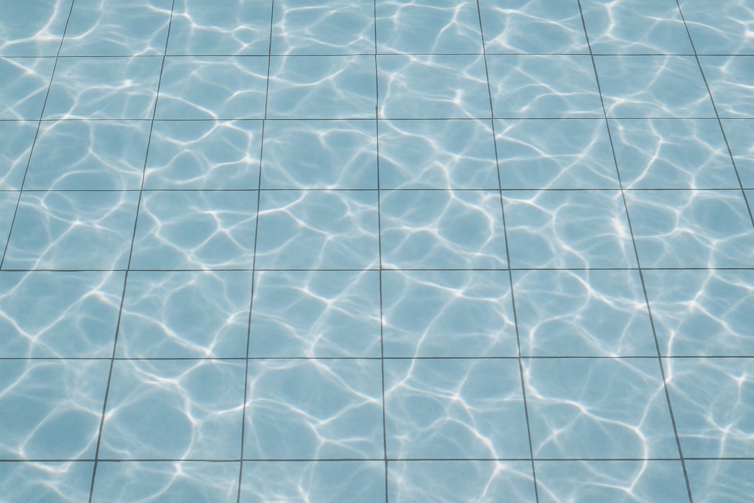 Caustic light on a tiled pool floor.